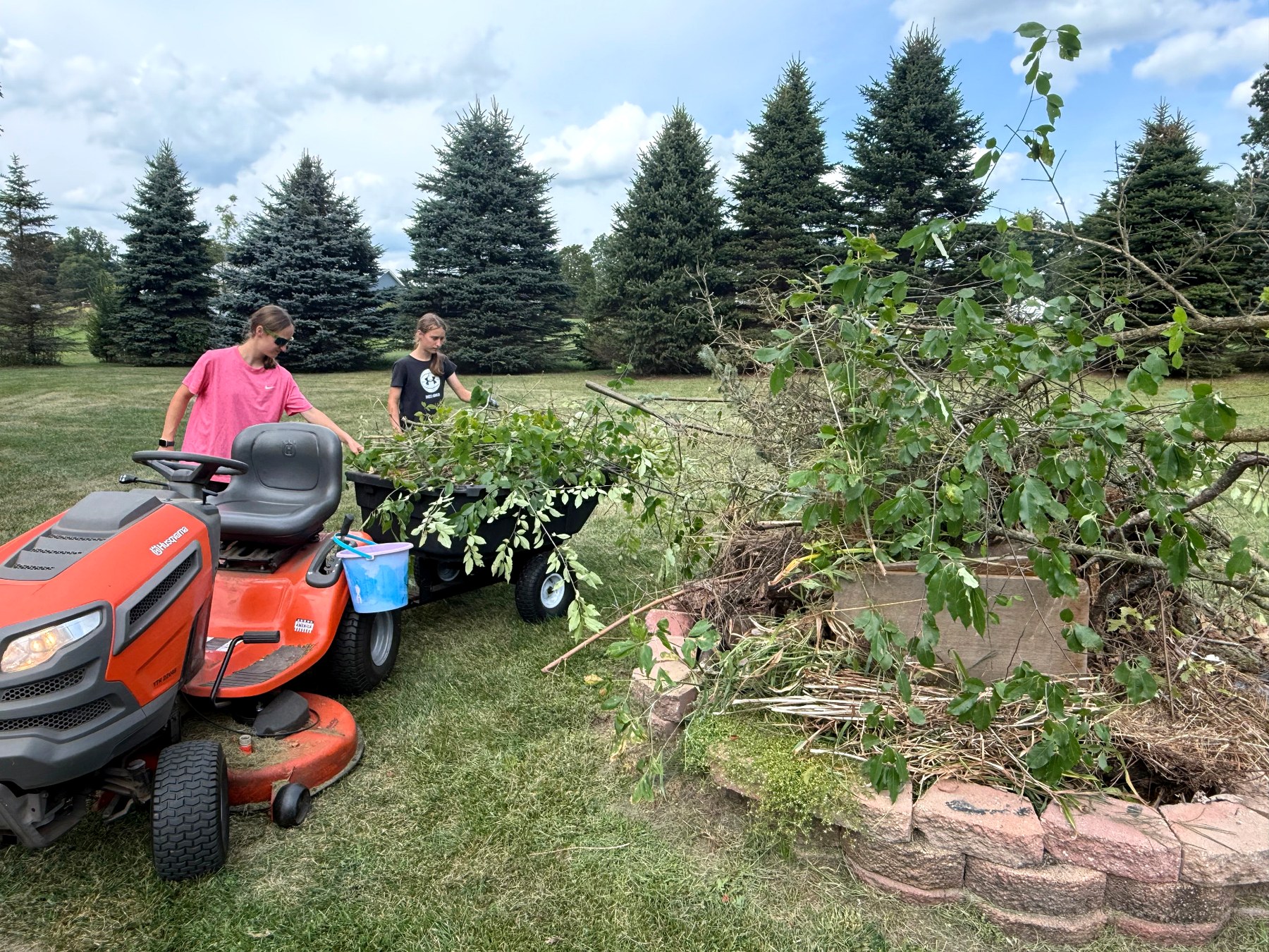 SRS family working on a large yard cleanup