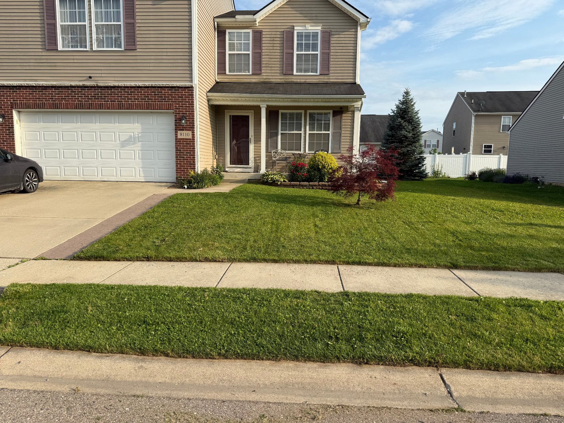 Freshly completed SRS lawn care at a Dexter neighborhood home